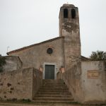 L'església de Santa Pellaia, antiga església parròquial, ofereix unes vistes impressionants sobre l'interior de les Gavarres. L'eslgésia està enganxada a la rectoria i en el conjunt si sumen un parell de masos i l'antic cementiri. Sobresurt per sobre de tots ells el campanar, una torre de planta quadrangular i acabat amb cúpula.